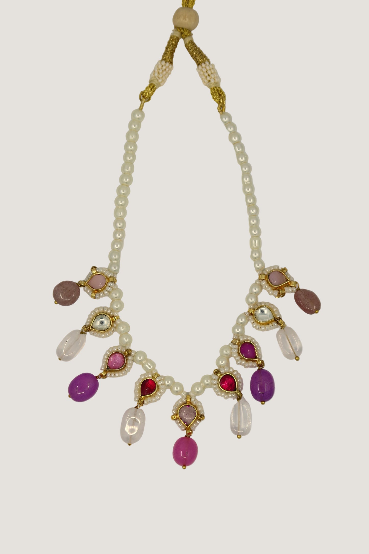 Necklace with pearls and colorful beads on a white background